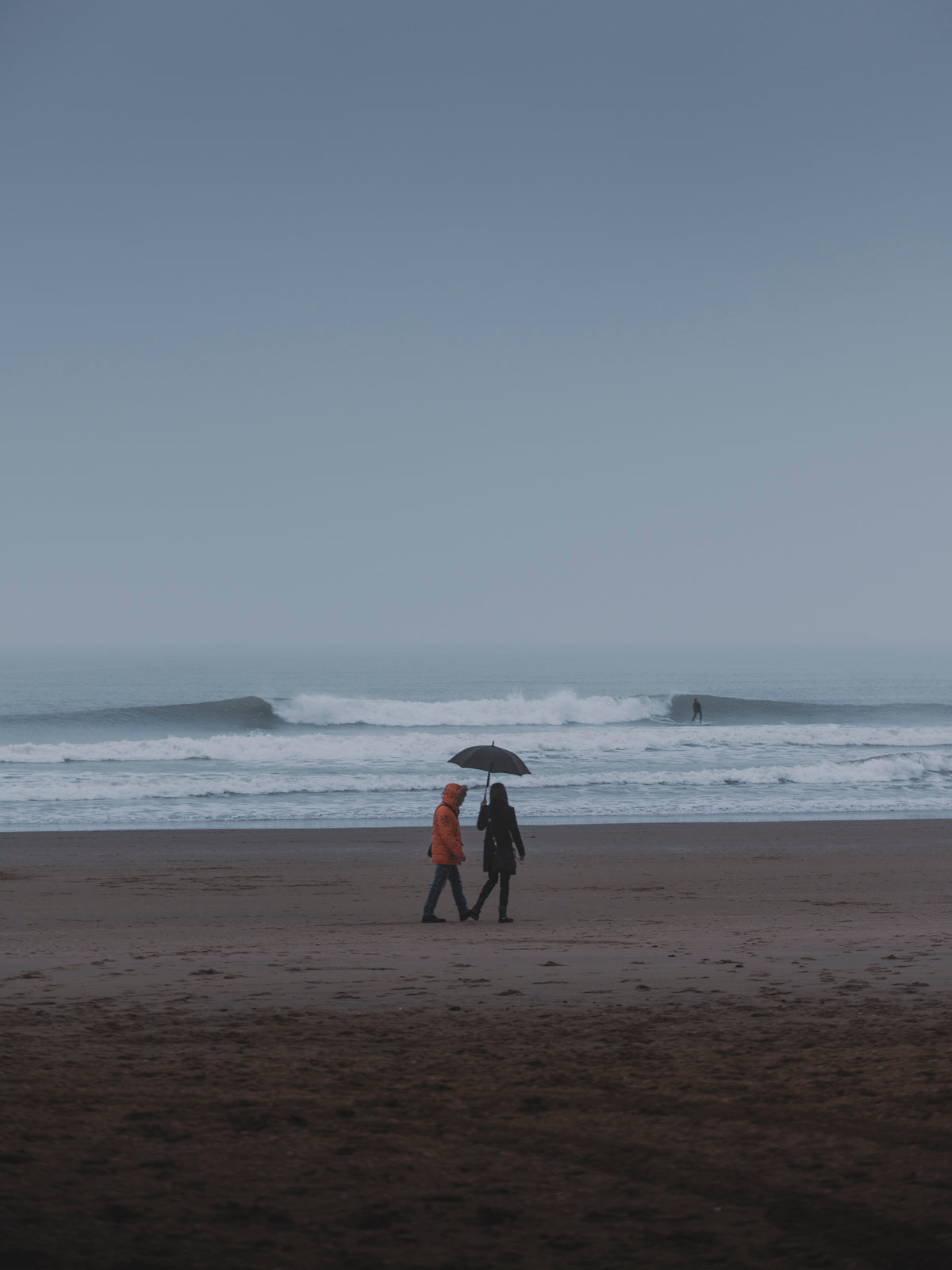 The Hague coastal scene in rainy weather with blue colours to emphasize the moody season. Photo art for your wall
