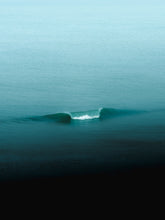 Load image into Gallery viewer, Minimalistic photograph of a breaking wave in a calm north sea. The white water from the wave is bright, the overall colour of the image is turquoise.
