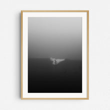 Load image into Gallery viewer, A photo of a surfer riding a wave but is barely visible in thick fog in Scheveningen, captured by Jop Hermans.
