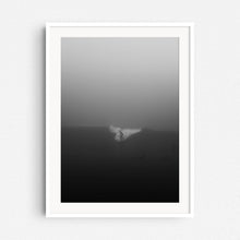 Load image into Gallery viewer, A photo of a surfer riding a wave but is barely visible in thick fog in Scheveningen, captured by Jop Hermans.
