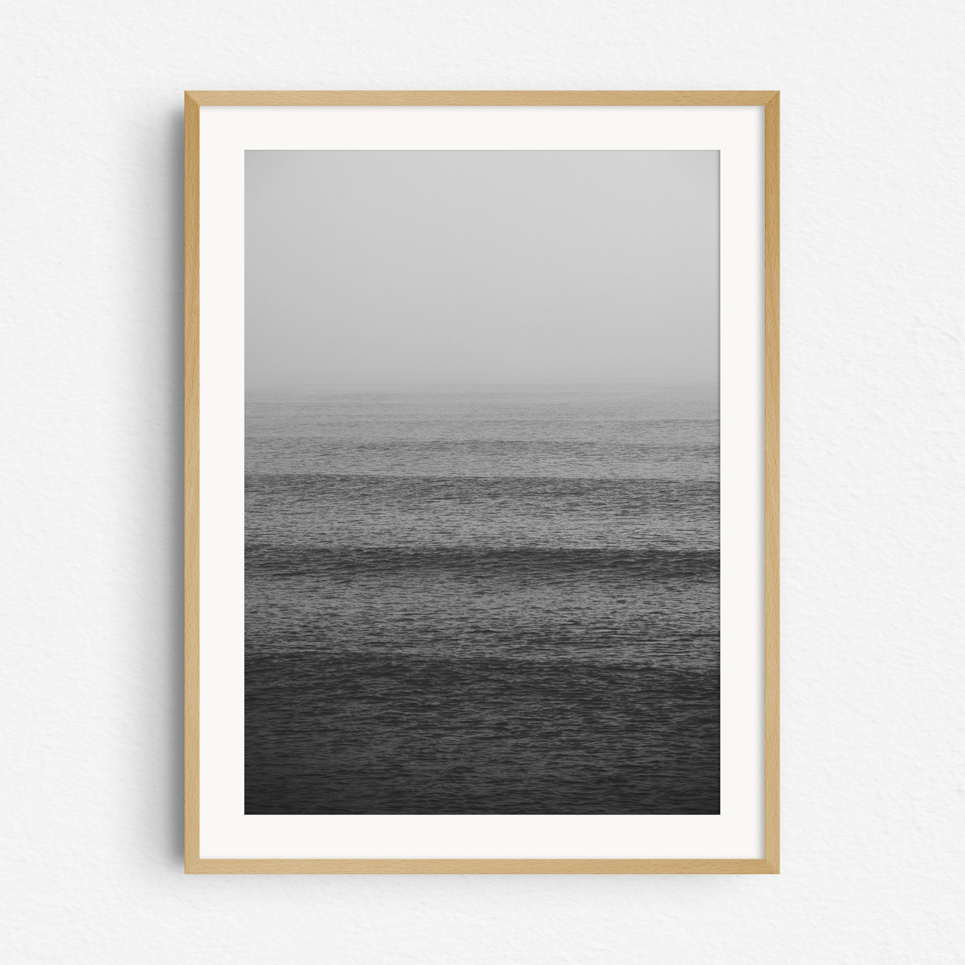 Black and white surf photography from the dutch coast in a natural wooden frame.