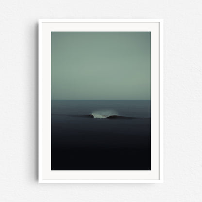 Turquoise surf art in a white wooden frame, captured by Jop Hermans.