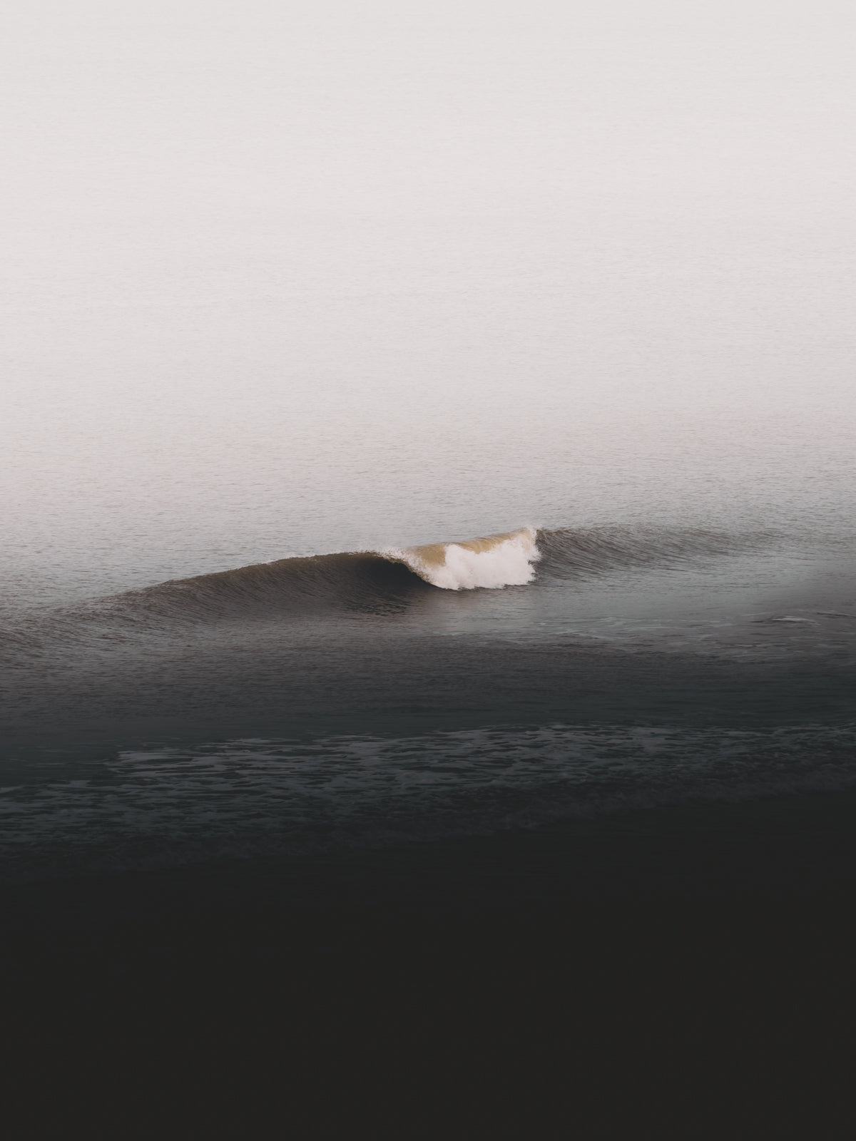 Photo of a single wave breaking in the Dutch part of the North Sea.