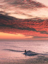 Load image into Gallery viewer, Summer surfing in the North Sea during a beautiful warm sunset.
