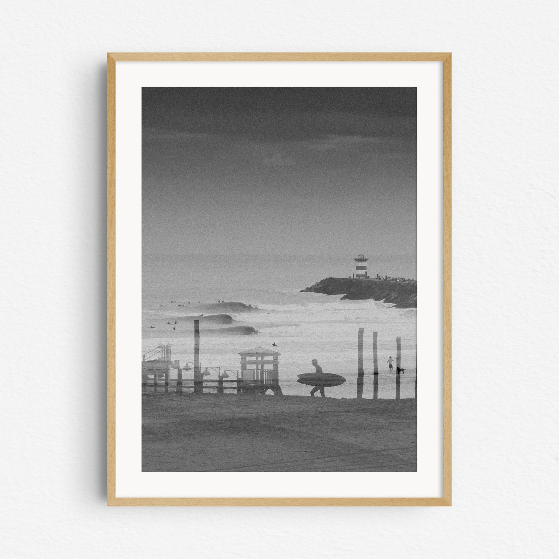 Double exposure surf photography in black and white, in a natural wooden frame.