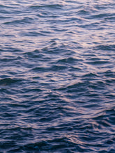 Load image into Gallery viewer, A close-up of the North Sea surface in a soft purple pastel haze. Beautiful ocean photography.
