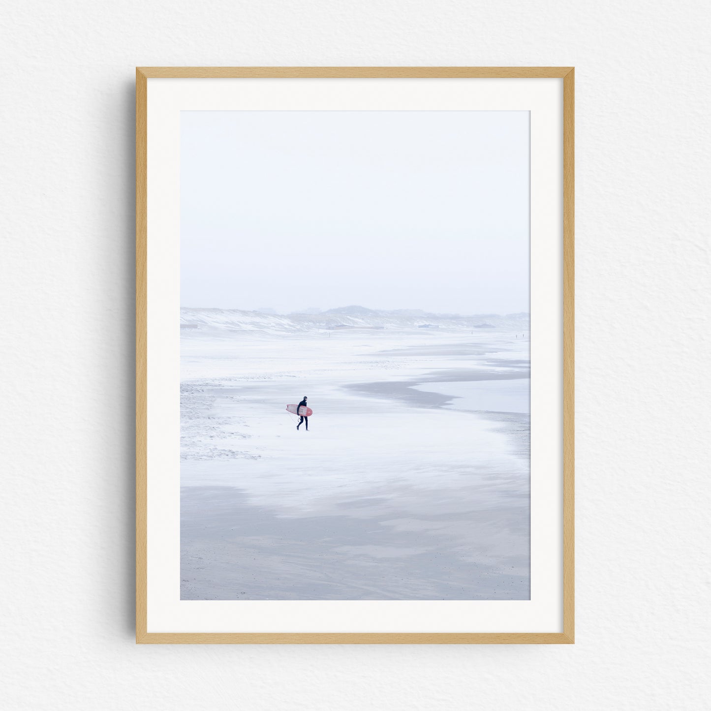 Winter surf photography in The Netherlands. A photo print in a natural wooden frame.