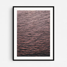 Load image into Gallery viewer, A photograph of the North Sea surface showing endless ripples coloured by the sunset, captured by Jop Hermans.
