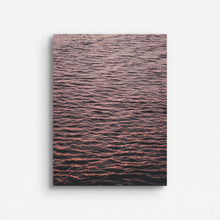 Load image into Gallery viewer, A photograph of the North Sea surface showing endless ripples coloured by the sunset, captured by Jop Hermans.
