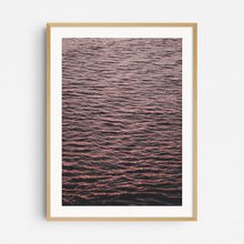 Load image into Gallery viewer, A photograph of the North Sea surface showing endless ripples coloured by the sunset, captured by Jop Hermans.
