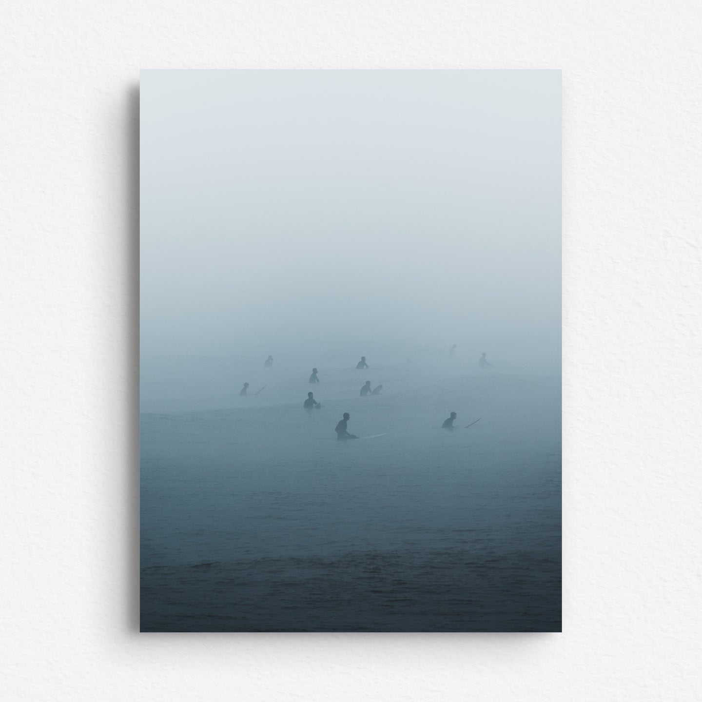 A dibond print of Dutch surf photography in the Hague. Surfers in the mist captured by Jop Hermans.