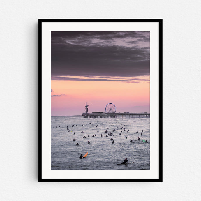 Surfers during sunset in front of the iconic Scheveninge pier, captured by Jop Hermans.