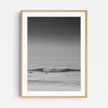 Load image into Gallery viewer, Two surfers paddle towards a broken wave in the North Sea, captured by Jop Hermans.
