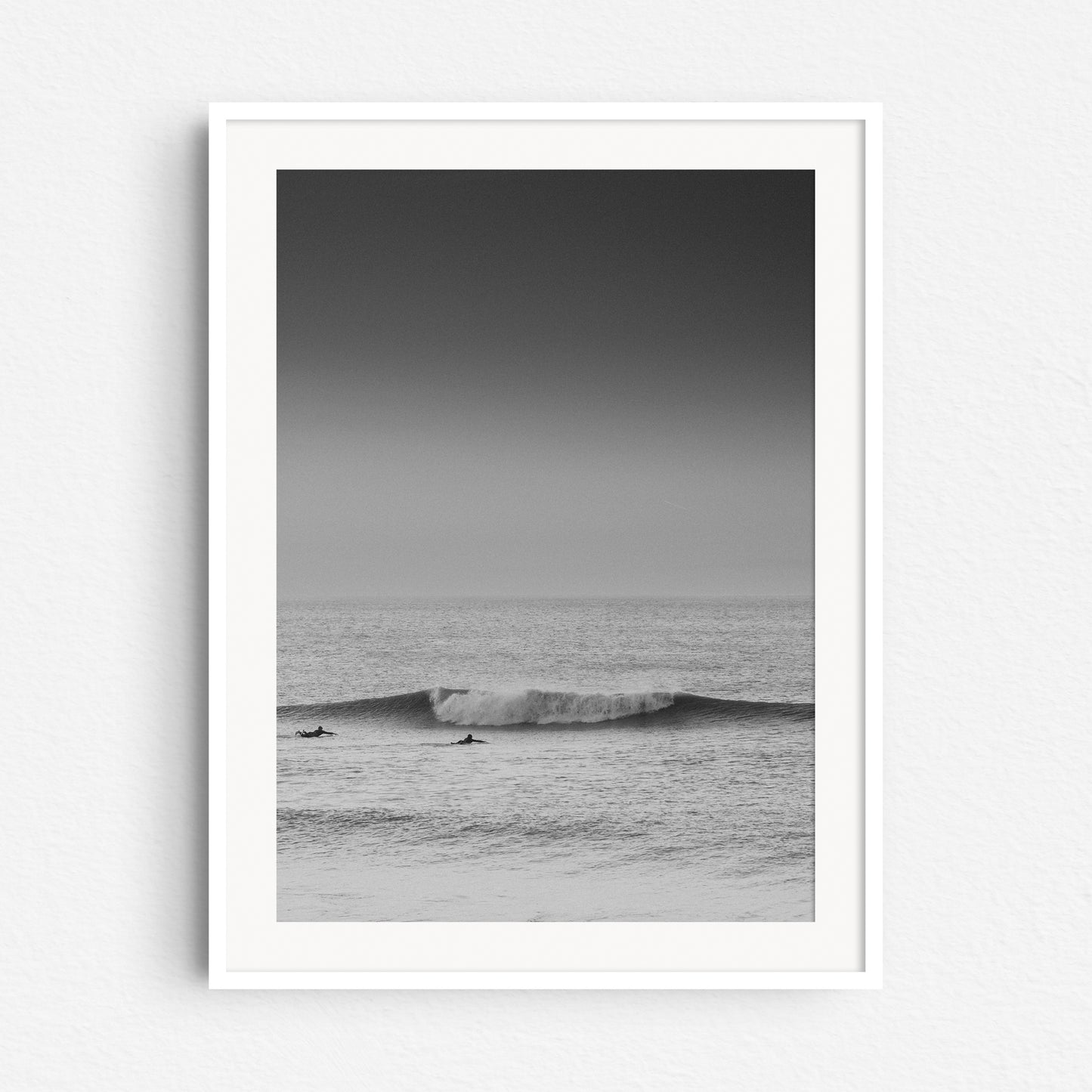 Minimal black and white photo art captured in Scheveningen. A photo print in a white wooden frame.