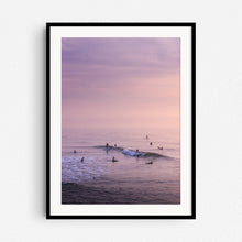 Load image into Gallery viewer, Surfers during a summer sunset in a colourful sea, in a black wooden frame.
