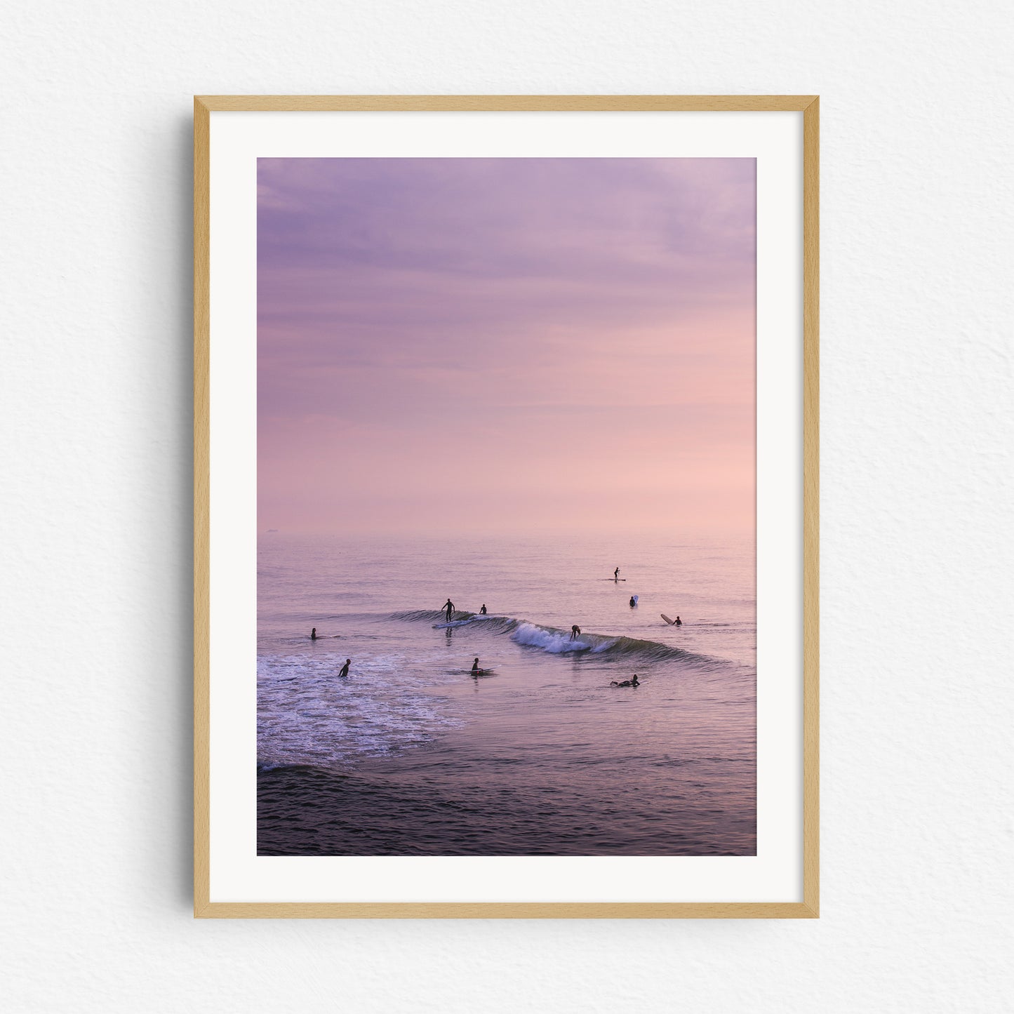 Summer surfing in The Hague captured by Jop Hermans, photo print in a natural wooden frame.