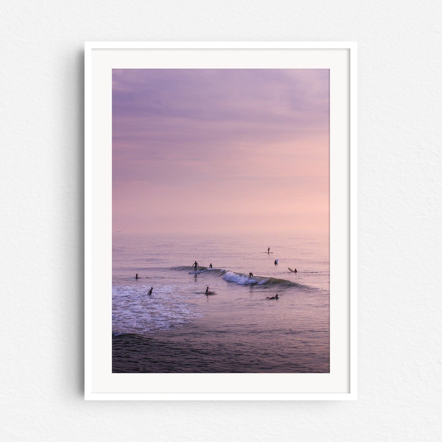 Summer surf photography from The Netherlands in a white wooden frame.