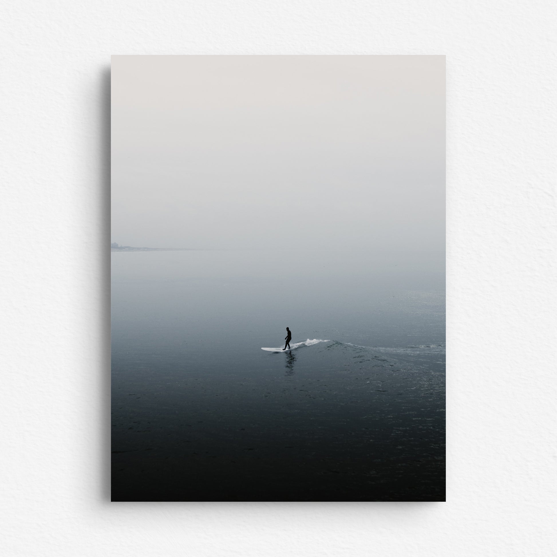 Silhouette of a surfer reflected in the water, printed on Dibond, offering a sleek and modern artwork poster on aluminum Dibond.