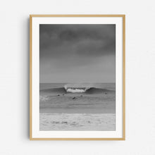 Load image into Gallery viewer, Big wave captured in Scheveningen by Jop Hermans. The black and white print in a natural wooden frame.
