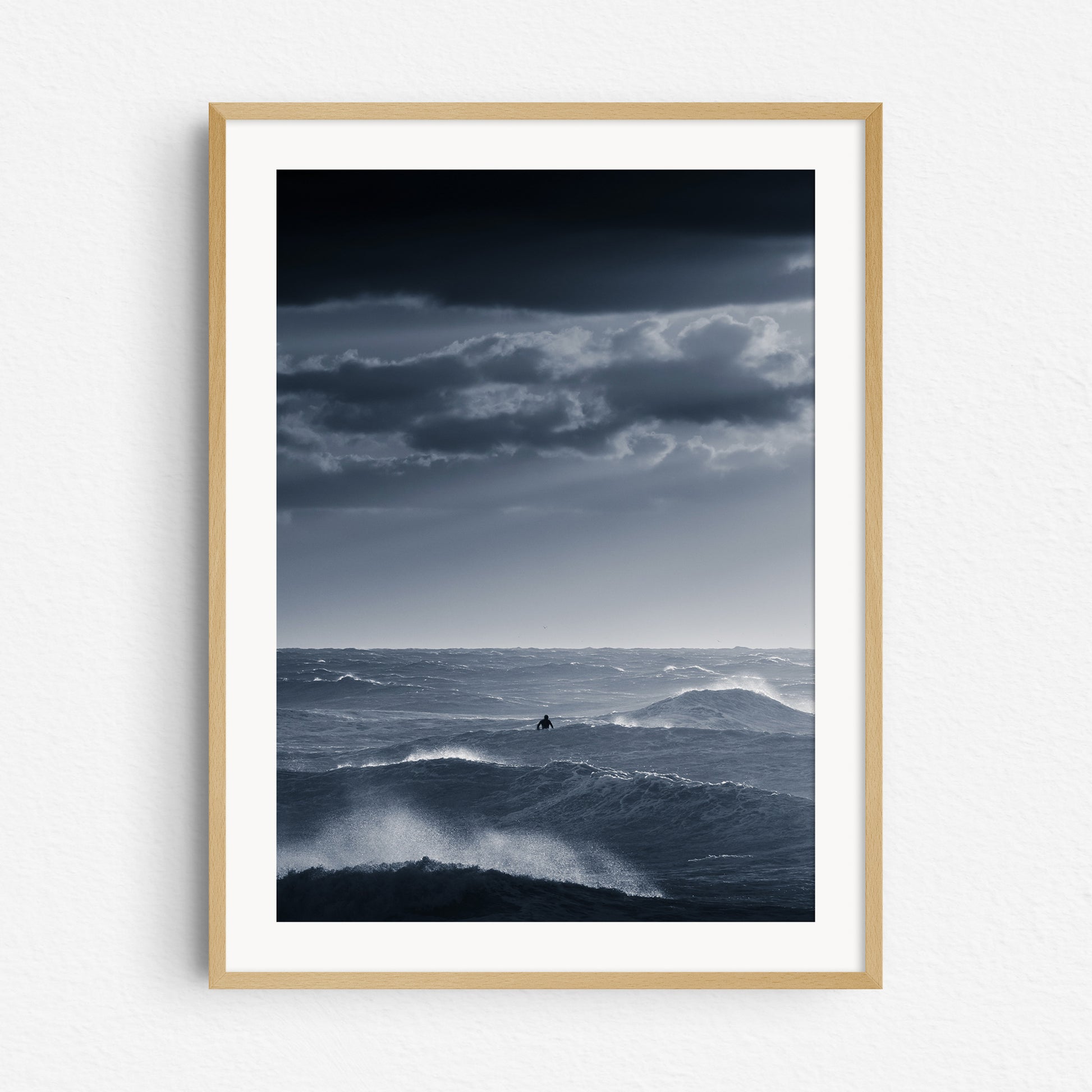 Dark and moody surf photography at the North Sea coast in a natural wooden frame.