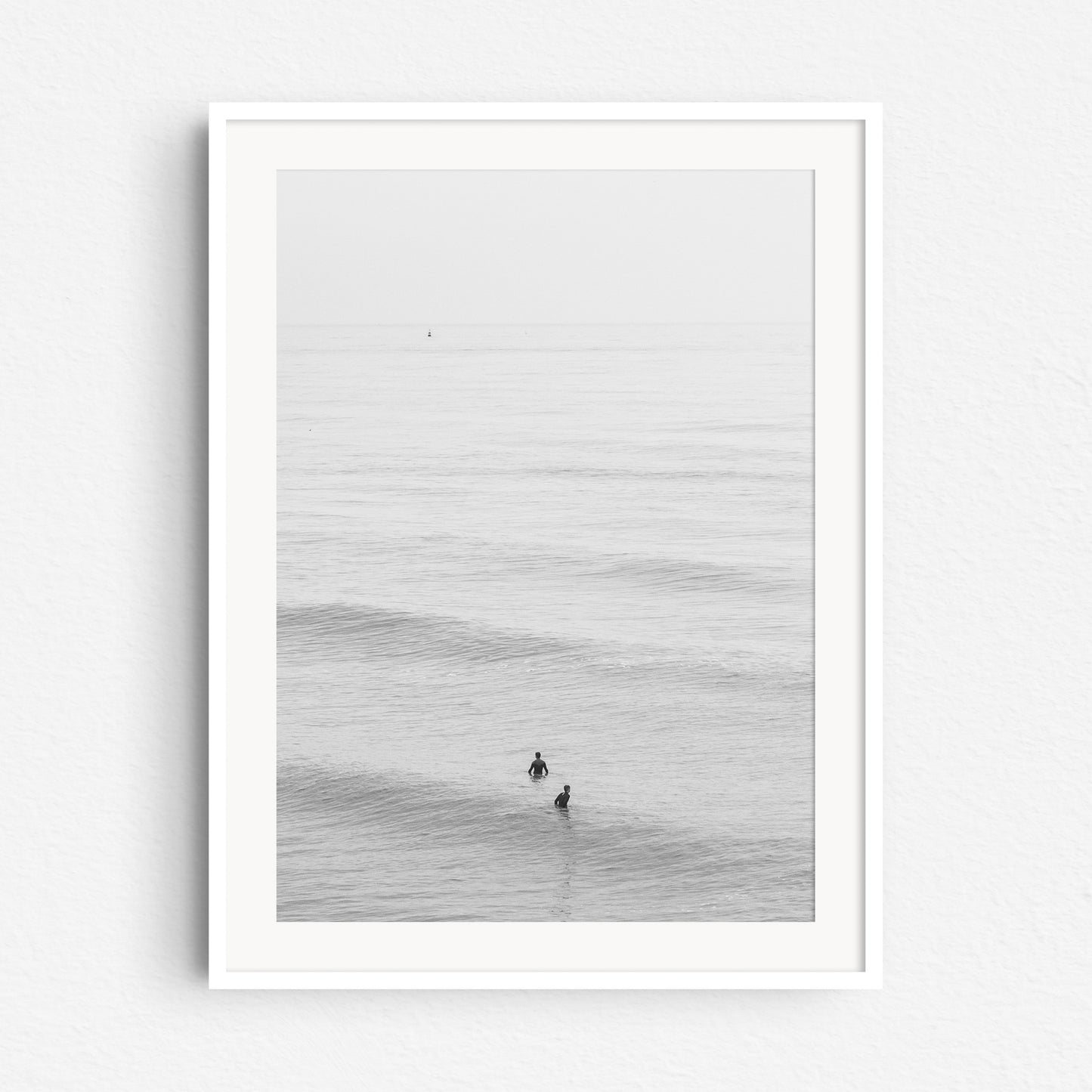 Framed surf photography in black and white from the Dutch coast, captured by Jop Hermans.