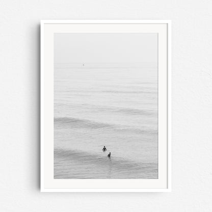 Framed surf photography in black and white from the Dutch coast, captured by Jop Hermans.