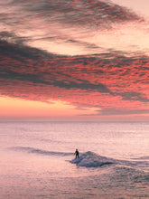 Load image into Gallery viewer, Vibrant sunset colors in Scheveningen with a surfer in a calming seascape. Perfect as tranquil wall art for your space.
