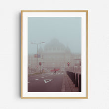 Load image into Gallery viewer, Surfer walking in front of the Grand Kurhaus hotel in Scheveningen. Surf print in a natural wooden frame.
