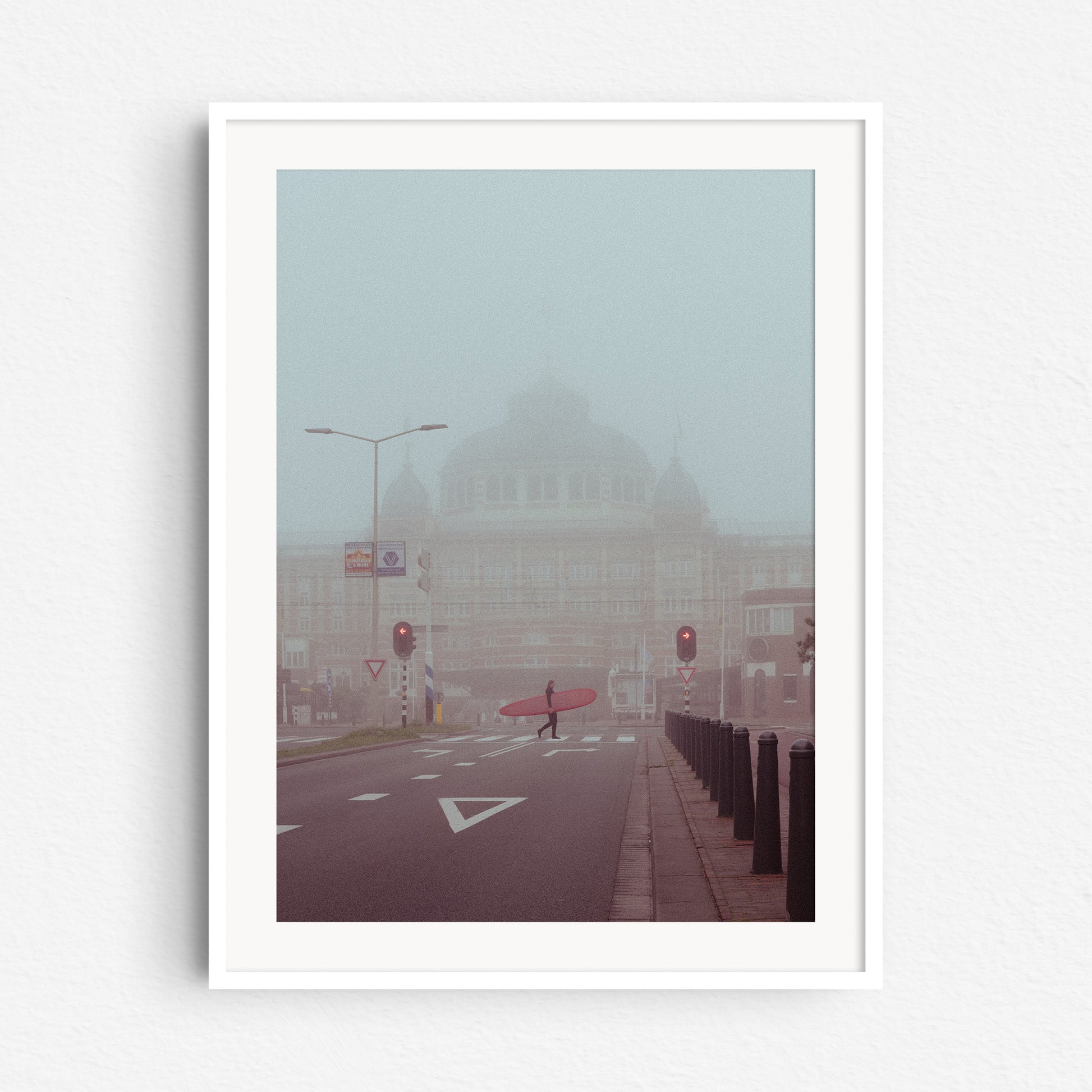 Surf photography from The Netherlands in a white wooden frame.