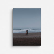 Load image into Gallery viewer, Two people carry an umbrella with a beautiful North Sea wave breaking in the background. Surf artwork printed on aluminum dibond for a sleek look.
