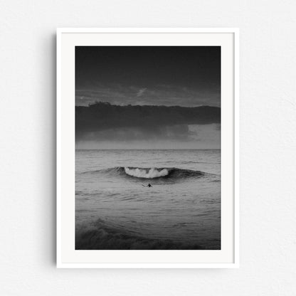 Black and white surf photography at the Scheveningen coast in a white wooden frame.