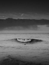 Load image into Gallery viewer, North Sea black and white surf shot of a surfer in the sea, captured by Jop Hermans.
