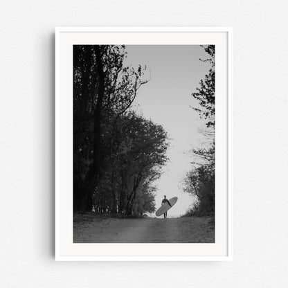 Black and white retro surf photo print in a white wooden frame, shot in The Hague.