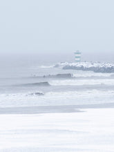 Load image into Gallery viewer, Big waves being surfed in a snowstorm in The Netherlands. Available as print, captured by Jop Hermans.
