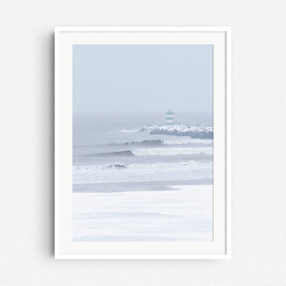 Framed winter surf photography from Scheveningen in a white wooden frame.