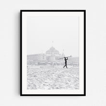 Load image into Gallery viewer, Winter surfer in The netherlands in front of the Scheveningen Kurhaus Hotel, framed in black wood.
