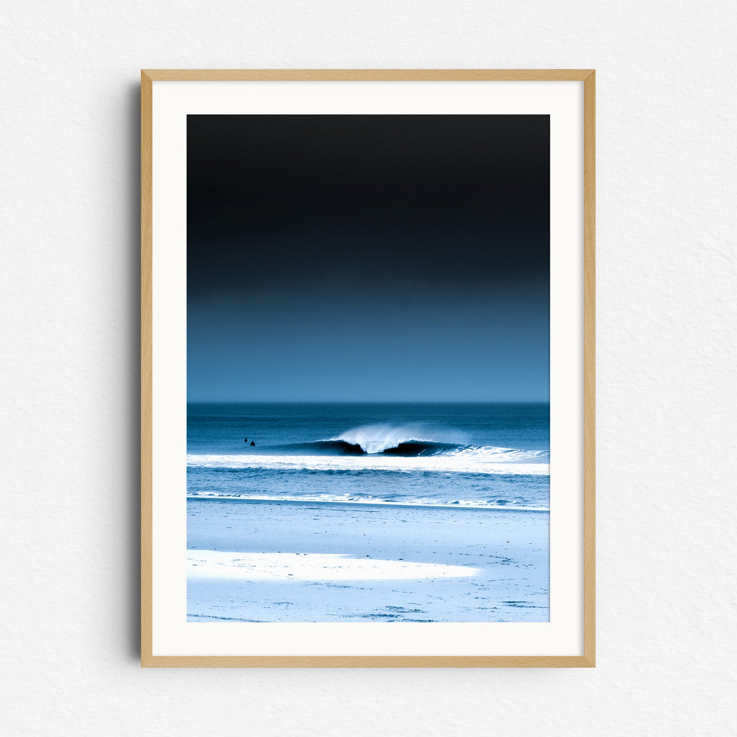 A clean breaking wave under a moody sky at Scheveningen beach. Framed in natural wood for a warm, organic touch. 