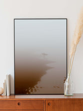 Load image into Gallery viewer, Surfer leaving the water in a thick fog on a cold winter morning. Captured by Jop Hermans
