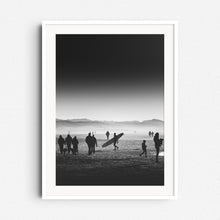 Load image into Gallery viewer, High contrast black and white photo of a beach scene with a longboarder, framed in white wood, perfect for elegant Wall decoration.
