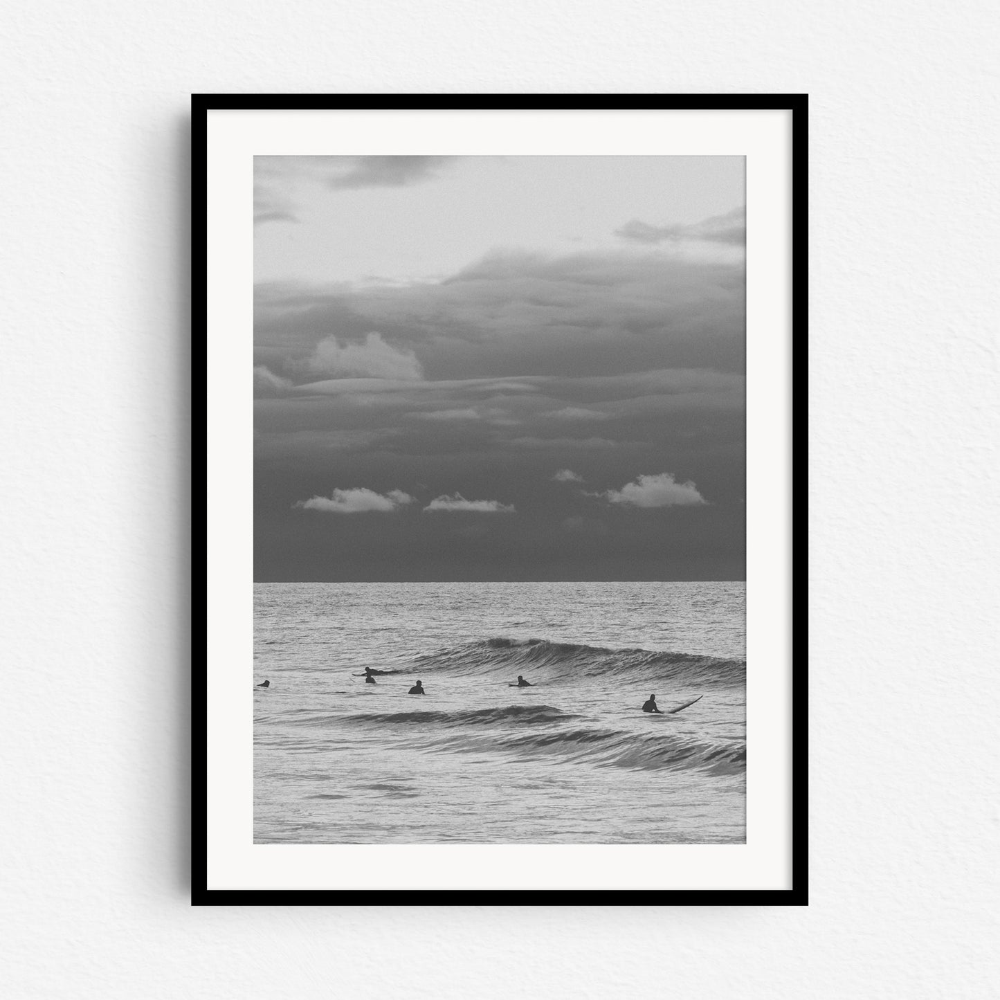 Surf photography from The Hague in a black wooden frame, captured by Jop Hermans.