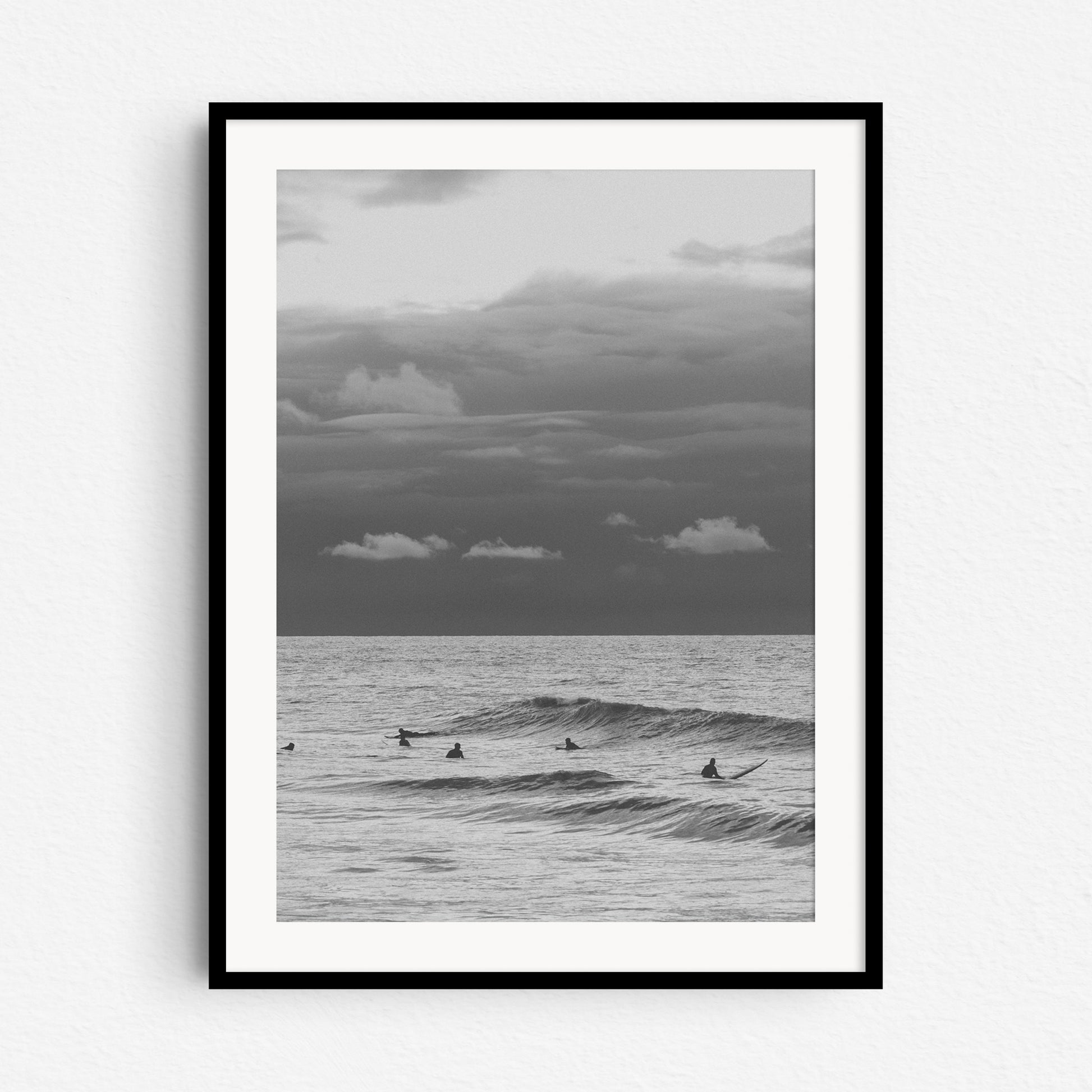 Surf photography from The Hague in a black wooden frame, captured by Jop Hermans.