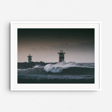 Load image into Gallery viewer, Cold wave breaking next to lighthouse in Scheveningen. Print in a white wooden frame.
