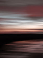 Load image into Gallery viewer, Long exposure minimalis panning photo taken on the beach during sunset in Scheveningen. The sky is has pastel colours.
