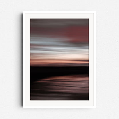 "'Dawn' North Sea sunset photo with soft red and blue tones. Framed in a modern white wooden frame."