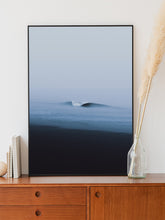 Load image into Gallery viewer, A perfectly formed wave on a grey North Sea day. Photo art from The Hague framed in black aluminum. Vibrant coastal wall art.
