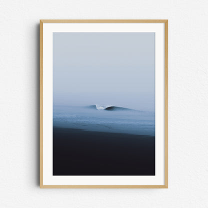 A clean, curling wave on a moody day in Scheveningen. Ocean artwork framed in natural wood for an organic, coastal vibe.