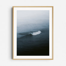 Load image into Gallery viewer, A single North Sea wave breaks in a mysterious setting with the horizon covered in fog. Framed in natural wood for calming wall art with sea and surf.
