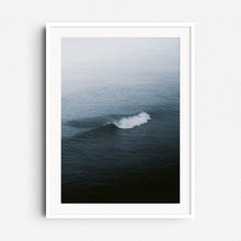 Load image into Gallery viewer, Serene breaking wave in a blueish misty seascape, framed in white wood, ideal for North Sea Surf artwork lovers.
