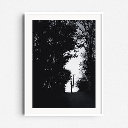 Minimalistic black and white photo of a surfer in the Scheveningen Westbroekpark, framed in white wood, perfect for elegant Wall decoration.