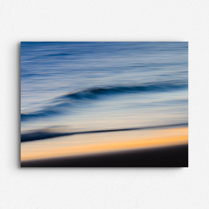 Long exposure photo of the North Sea water surface, with a blue and orange haze. Printed on Dibond for a modern finish.